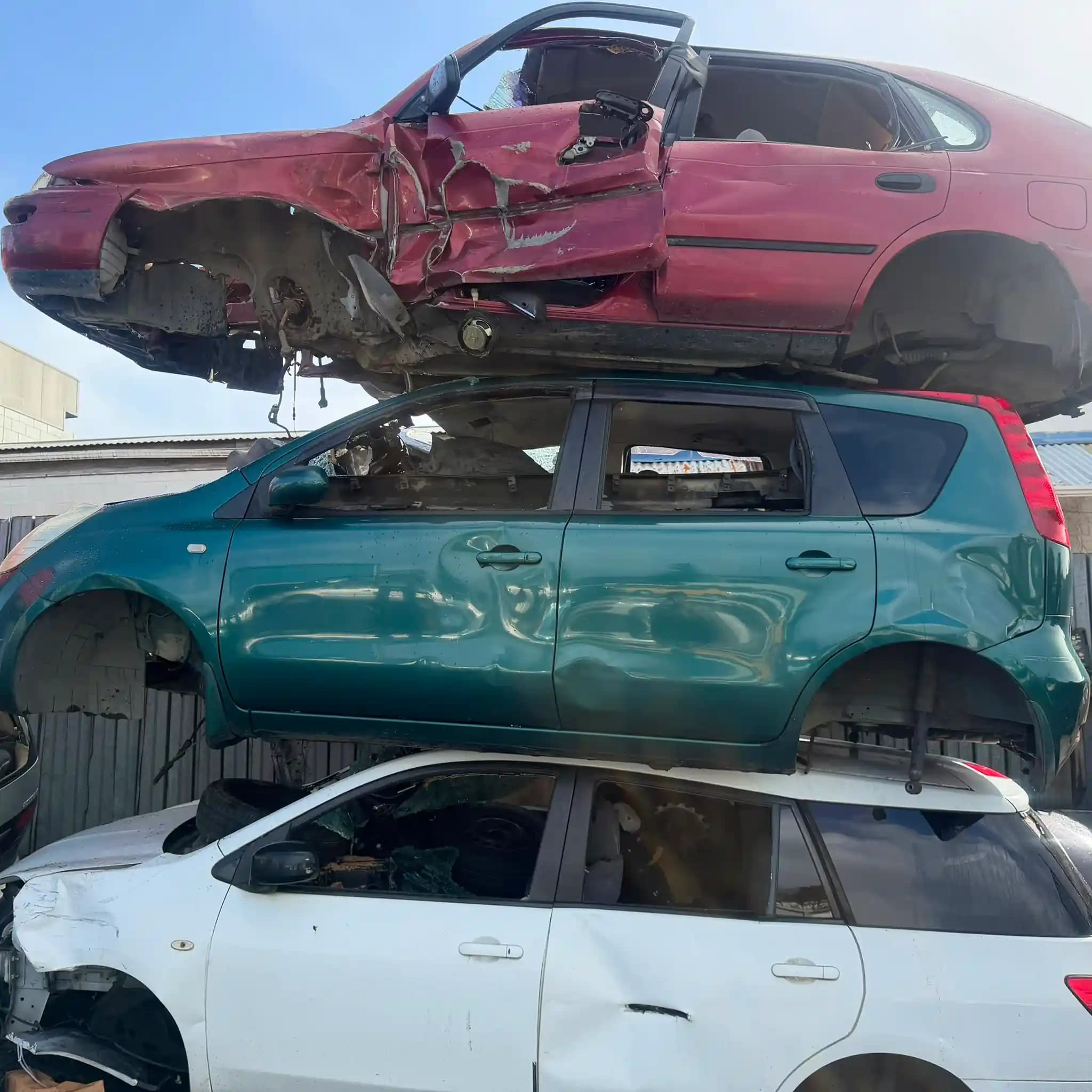 A damaged vehicle being assessed for free car recycling collection in Hamilton